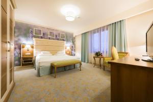 Postel nebo postele na pokoji v ubytování Hotel Sonnenhof
