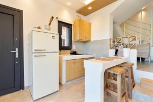 Η κουζίνα ή μικρή κουζίνα στο Green Sea Villas