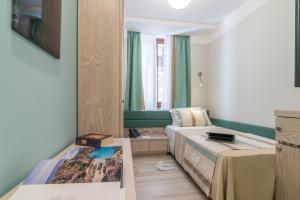 Postel nebo postele na pokoji v ubytování L'Ambasciata Hotel de Charme