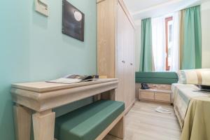 Postel nebo postele na pokoji v ubytování L'Ambasciata Hotel de Charme