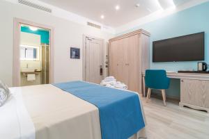 Postel nebo postele na pokoji v ubytování L'Ambasciata Hotel de Charme