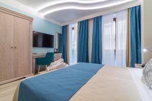 Postel nebo postele na pokoji v ubytování L'Ambasciata Hotel de Charme