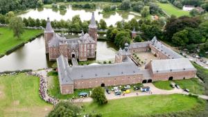 an aerial view of a castle with a large building at House Hommert Hoensbroek in Hoensbroek