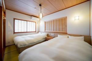 En eller flere senge i et værelse på 波音テラス天草