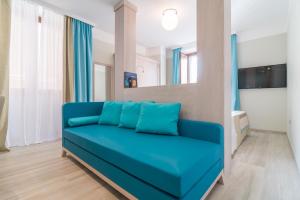 TV a/nebo společenská místnost v ubytování L'Ambasciata Hotel de Charme