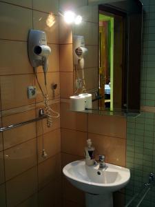 a bathroom with a sink and a mirror at Guest Accommodation Etno Konak Tašana in Niš