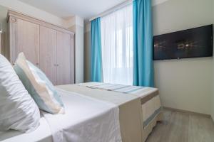 Postel nebo postele na pokoji v ubytování L'Ambasciata Hotel de Charme