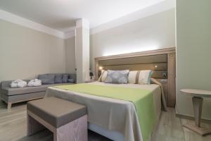 Postel nebo postele na pokoji v ubytování L'Ambasciata Hotel de Charme