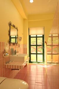 a bathroom with a sink and a mirror at 布拉諾城堡 in Taitung City