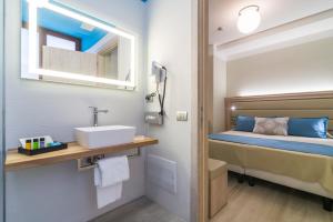 Postel nebo postele na pokoji v ubytování L'Ambasciata Hotel de Charme