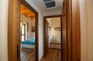 a hallway with a bedroom with a bed and a door at Moresco Agriturismo in Moresco +85 photos
