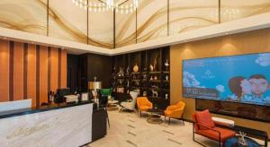 TV a/nebo společenská místnost v ubytování Magnotel Tongxiang Shimao Center