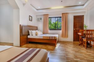 Postel nebo postele na pokoji v ubytování Jurias Garden Hotel + 79 fotografií