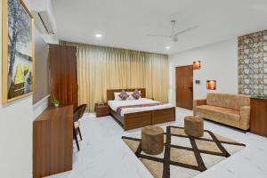 Ένα ή περισσότερα κρεβάτια σε δωμάτιο στο FabHotel ANS KP