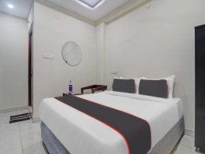 Ένα ή περισσότερα κρεβάτια σε δωμάτιο στο Hotel O SQUARE UNIQUE SUITES