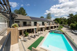 an aerial view of a building with a swimming pool at Balaton Flow Residence in Fonyód