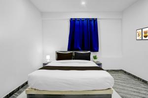 Giường trong phòng chung tại Hotel O by OYO AS Paradise