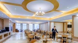 TV a/nebo společenská místnost v ubytování Vienna Hotel Anhui Fuyang Funan Bailing Apartment