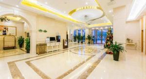 a large room with a dance floor in a building at Vienna Hotel Nanjing Zhongshan Mausoleum in Qilinmen