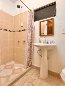 a bathroom with a sink and a shower at Hotel 305 in Parras de la Fuente +39 photos
