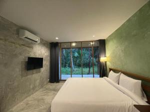 Телевизор и/или развлекательный центр в COCO Home 2 โคโค่โฮม เฟส 2