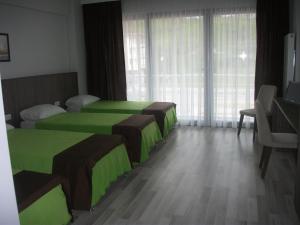 Postel nebo postele na pokoji v ubytování Mori Sport Hotel + 52 fotografií