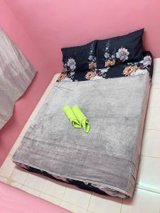 Ένα ή περισσότερα κρεβάτια σε δωμάτιο στο Amani guesthouse