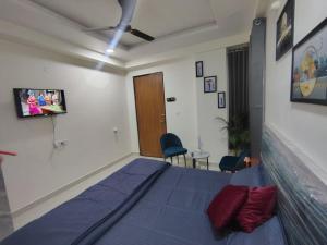 En eller flere senge i et værelse på The Velvet Rooms