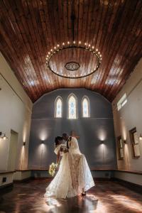 a bride and groom dancing in a church at Glen Eden Lodge in Lidgetton