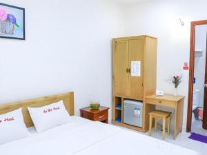 Postel nebo postele na pokoji v ubytování Ha My Hotel