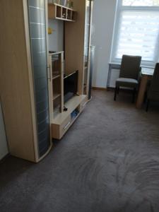 Μια τηλεόραση ή/και κέντρο ψυχαγωγίας στο 70 qm Ferienwohnung mit 2 Schlafzimmern