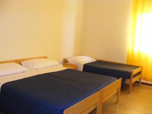 Voodi või voodid majutusasutuse Hotel Turismo toas