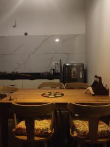 a large wooden table with chairs in a room at Virudravilla in Jodhpur +29 photos