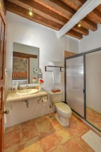 a bathroom with a toilet and a sink at Alqueria de Carrion Hotel Boutique in Atlixco