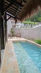 Бассейн в Lotus by Suasana Villa или поблизости