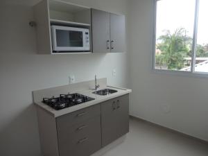 Loft Florianópolis no Campeche tesisinde mutfak veya mini mutfak