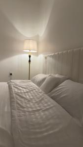 Postel nebo postele na pokoji v ubytování شقه بصالة وغرفة نوم مريحة