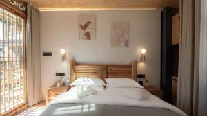 Ένα ή περισσότερα κρεβάτια σε δωμάτιο στο Nostalgia 28 lodge