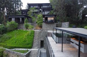 a house on the side of a hill with stairs at Elevate Ella Resort & Spa in Ella