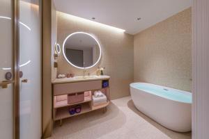 Ένα μπάνιο στο Hefei MixC Olympic Sports Center Manxin Hotel +34 φωτογραφίες