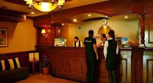 a group of people standing at a bar at Batangas in Dilao