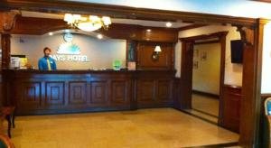 a man standing at a bar in a restaurant at Batangas in Dilao