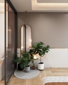 a bedroom with potted plants in a room at CBD Luxury Apartment in Rivergate Tower in Ho Chi Minh City
