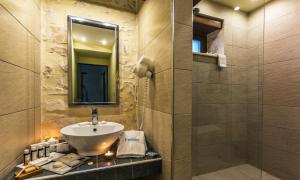A bathroom at Exensian Villas & Suites