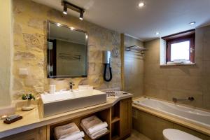 A bathroom at Exensian Villas & Suites