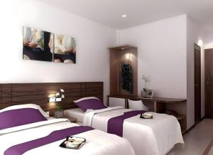 Un pat sau paturi într-o cameră la Amantis Hotel +129 fotografii