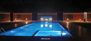 Πισίνα στο ή κοντά στο Oscar club farmhouse and Resorts