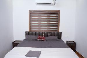 Ένα ή περισσότερα κρεβάτια σε δωμάτιο στο Paradise Riviera