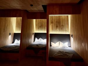 two bunk beds with white pillows in a room at Naturhotel Die Maise in Hayingen +153 photos