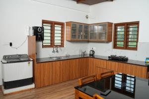 Η κουζίνα ή μικρή κουζίνα στο Paradise Riviera